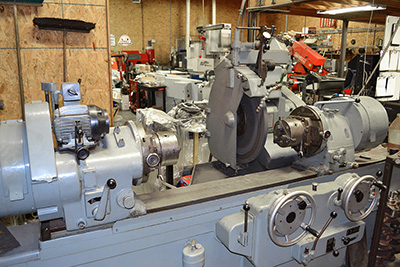 Engine machine shop equipment, crankshaft grinder.